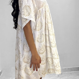 Tunique en dentelle blanche et dorée